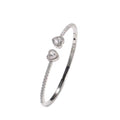 Silver bracelet with heart-shaped charms on a white background